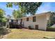 Backyard with a white brick house, small deck with stairs, and grassy area at 2070 Brannen Se Rd, Atlanta, GA 30316