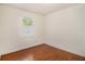Clean and neutral bedroom with hardwood floors and window at 2070 Brannen Se Rd, Atlanta, GA 30316