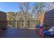 Cozy outdoor seating area on a wood balcony, perfect for relaxing and enjoying the view at 2323 Mason Dr # D21, Atlanta, GA 30316