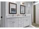 Bathroom with double vanity, large framed mirrors, and glass enclosed shower at 2323 Mason Dr # D21, Atlanta, GA 30316