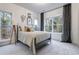 Bright bedroom featuring large windows, carpet flooring, and tasteful decor at 2323 Mason Dr # D21, Atlanta, GA 30316