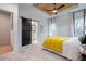 Bedroom with a barn door, soft carpet, tray ceiling, and bright natural light at 2323 Mason Dr # D21, Atlanta, GA 30316