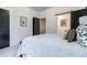 Bedroom featuring a comfortable bed, modern accents, and neutral decor at 2323 Mason Dr # D21, Atlanta, GA 30316