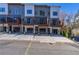 Modern townhome exterior with a driveway, individual garages, and small balcony area at 2323 Mason Dr # D21, Atlanta, GA 30316