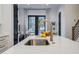 Close-up view of the kitchen island's sink and faucet, adjacent to the patio at 2323 Mason Dr # D21, Atlanta, GA 30316