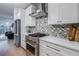 Kitchen featuring stainless steel appliances, and designer tile backsplash at 2323 Mason Dr # D21, Atlanta, GA 30316