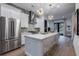 Bright kitchen with stainless appliances, white island with seating, and decorative backsplash at 2323 Mason Dr # D21, Atlanta, GA 30316