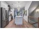 Open-concept kitchen with a quartz island, stainless appliances, and modern light fixtures at 2323 Mason Dr # D21, Atlanta, GA 30316