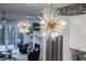 Stylish light fixtures illuminate a modern kitchen overlooking the comfortable living room at 2323 Mason Dr # D21, Atlanta, GA 30316
