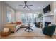 Comfortable living room with a fireplace, large windows, and neutral decor at 2323 Mason Dr # D21, Atlanta, GA 30316