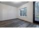 Neutral room featuring hardwood style floors, ample natural light, and white walls at 2323 Mason Dr # D21, Atlanta, GA 30316