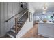 Elegant staircase with wooden railings, leading to a light-filled living area and kitchen at 2323 Mason Dr # D21, Atlanta, GA 30316