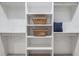 Walk-in closet with built-in shelving, hanging rods, and plenty of storage space at 2323 Mason Dr # D21, Atlanta, GA 30316