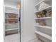 Walk-in closet featuring custom shelving for storage, laundry supplies and towels at 2323 Mason Dr # D21, Atlanta, GA 30316