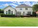Expansive backyard with a well-maintained lawn, deck, and established greenery, ideal for outdoor living at 3049 Brightwood Se Ln, Marietta, GA 30067