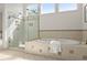 Beautiful bathroom featuring a soaking tub and a glass-enclosed shower at 3049 Brightwood Se Ln, Marietta, GA 30067