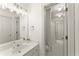 Bright bathroom with tile flooring, a long vanity, and a well-lit mirror perfect for everyday use at 3049 Brightwood Se Ln, Marietta, GA 30067
