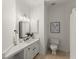 Clean bathroom features a vanity, black hardware, a mirror, and tiled floors at 3049 Brightwood Se Ln, Marietta, GA 30067