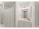 Well-lit bathroom with vanity, mirror, and shower/tub combo, designed for comfort and convenience at 3049 Brightwood Se Ln, Marietta, GA 30067