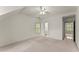 Open bedroom with neutral carpeting, ensuite bathroom, and a light and airy ambiance at 3049 Brightwood Se Ln, Marietta, GA 30067