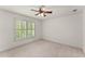 Comfortable bedroom featuring a window, ceiling fan and neutral tones at 3049 Brightwood Se Ln, Marietta, GA 30067
