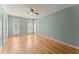 Inviting bedroom boasts hardwood floors, three windows, and tranquil green walls offering calm at 3049 Brightwood Se Ln, Marietta, GA 30067