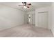 Spacious bedroom features neutral carpet, ceiling fan, and ample closet space for functional living at 3049 Brightwood Se Ln, Marietta, GA 30067