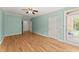 Charming bedroom with hardwood floors, french doors, and tranquil green walls offering calm at 3049 Brightwood Se Ln, Marietta, GA 30067