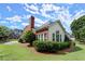 Charming home showcasing manicured landscaping and brick accents, enhancing its curb appeal at 3049 Brightwood Se Ln, Marietta, GA 30067