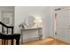 Inviting foyer with hardwood floors, console table, decorative mirror, and a view towards the front door at 3049 Brightwood Se Ln, Marietta, GA 30067