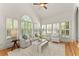 Comfortable living room with large windows, neutral furniture, plantation shutters, and hardwood floors at 3049 Brightwood Se Ln, Marietta, GA 30067
