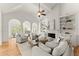 Spacious living room featuring high ceilings, large windows, fireplace, built-in shelves, and hardwood floors at 3049 Brightwood Se Ln, Marietta, GA 30067
