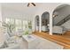Open living room with high ceilings, exposed beams, views to the staircase and living room, and plenty of light at 3049 Brightwood Se Ln, Marietta, GA 30067