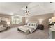 Serene main bedroom with tray ceiling, window seat, and neutral decor creates a relaxing retreat at 3049 Brightwood Se Ln, Marietta, GA 30067