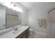 Well-lit bathroom featuring a long vanity with a white countertop, a toilet, and a shower-tub combo at 485 Discovery Lake Dr, Fayetteville, GA 30215