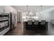Modern kitchen with stainless steel appliances, large island, and sleek cabinets at 485 Discovery Lake Dr, Fayetteville, GA 30215