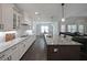 Large kitchen featuring an island, white cabinets, and granite countertops at 485 Discovery Lake Dr, Fayetteville, GA 30215