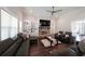 Relaxing living room showcasing a stone fireplace, built-in shelving, and comfortable seating at 485 Discovery Lake Dr, Fayetteville, GA 30215