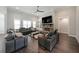 Living room featuring a stone fireplace, built-in shelving, and comfortable leather seating at 485 Discovery Lake Dr, Fayetteville, GA 30215