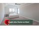 Bright main bedroom featuring a tray ceiling, neutral paint, and comfortable carpet at 485 Discovery Lake Dr, Fayetteville, GA 30215