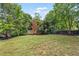Expansive backyard featuring green space and privacy fence at 5415 Fieldfreen Dr, Cumming, GA 30028