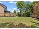 Spacious backyard with lush lawn and manicured garden beds at 5415 Fieldfreen Dr, Cumming, GA 30028