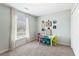 Inviting bedroom with table, bright natural light, and closet for ample storage at 5415 Fieldfreen Dr, Cumming, GA 30028
