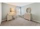 Bright bedroom with a vanity and a dresser, offering a serene space for relaxation and personal care at 5415 Fieldfreen Dr, Cumming, GA 30028