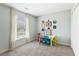 This charming bedroom features bright natural light and a fun play area with a small desk at 5415 Fieldfreen Dr, Cumming, GA 30028