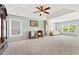 Spacious bonus room with large windows, plenty of light and comfortable furnishings at 5415 Fieldfreen Dr, Cumming, GA 30028