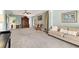 Spacious bonus room featuring a comfortable couch, seating and plenty of room at 5415 Fieldfreen Dr, Cumming, GA 30028