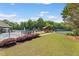Community amenities featuring a swimming pool, playground, and tennis courts surrounded by lush greenery at 5415 Fieldfreen Dr, Cumming, GA 30028