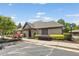 Community center with well-maintained landscaping, mature trees, and ample parking at 5415 Fieldfreen Dr, Cumming, GA 30028