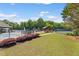 Community pool and playground area featuring a pool, playground, and tennis courts at 5415 Fieldfreen Dr, Cumming, GA 30028